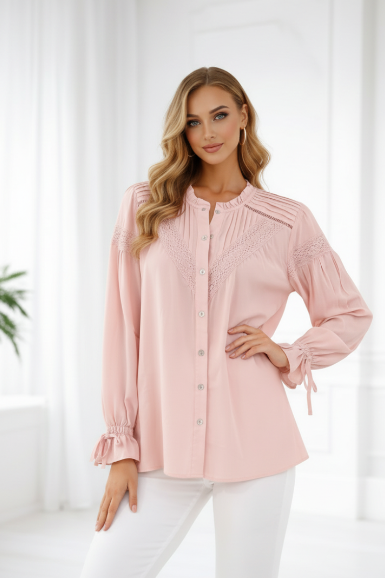 Woman wearing a pink blouse with white pants against a white background