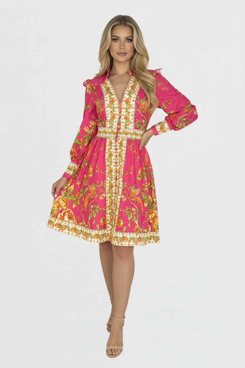 A woman modeling a vibrant pink A-line midi dress with a floral print and a cinched waist.