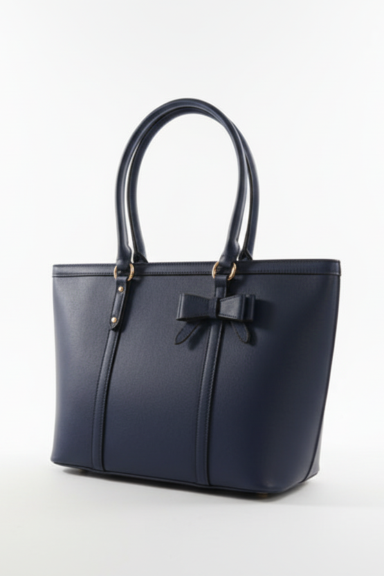 Navy blue handbag with a bow on a white background