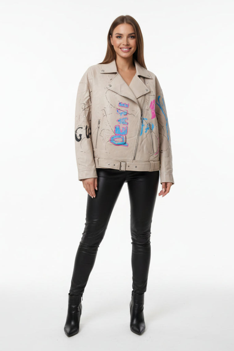 Woman wearing a beige jacket with colorful text design on a white background