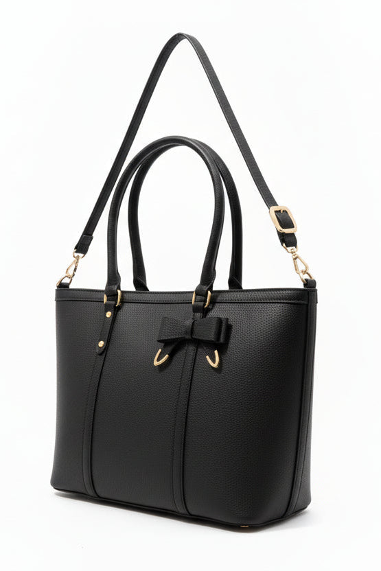 Beige handbag with a bow detail on a white background