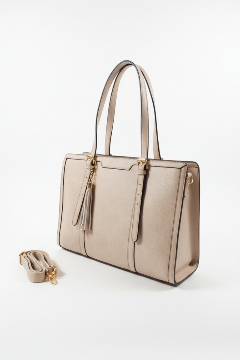Beige handbag with a matching shoe on a white background