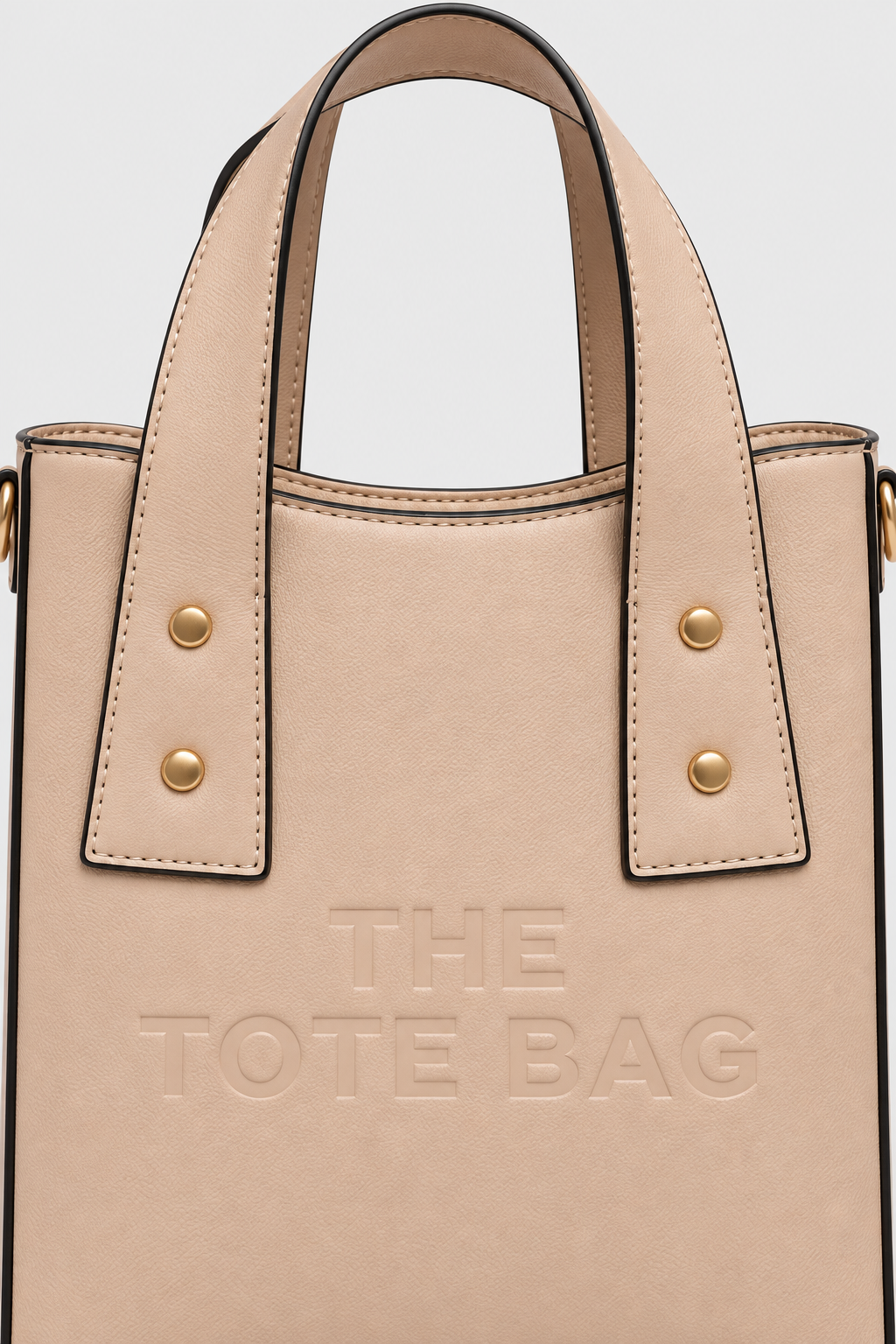 Close-up of apricot beige tote bag texture and embossed front design
